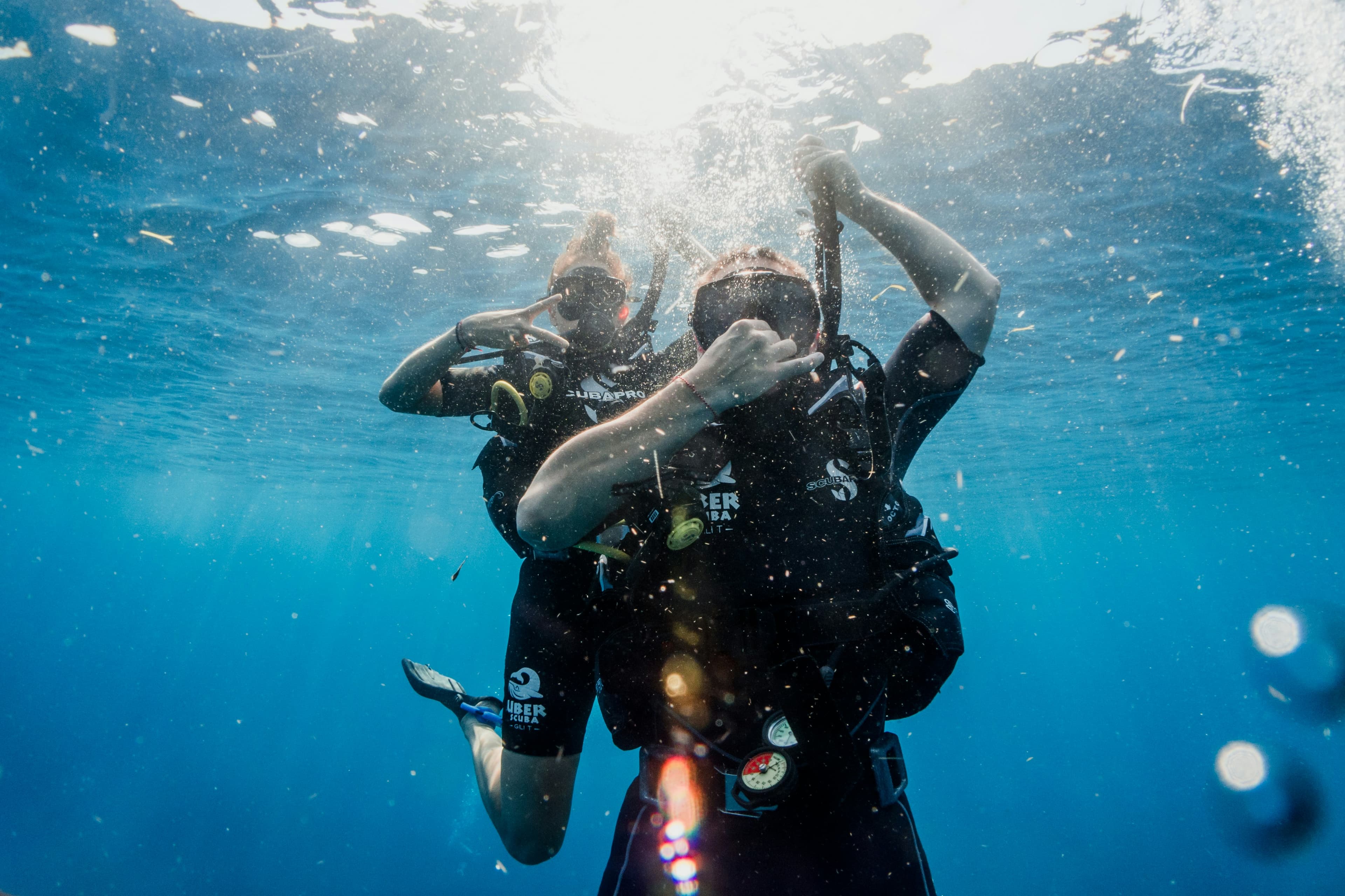 Buddy team in sunlit water