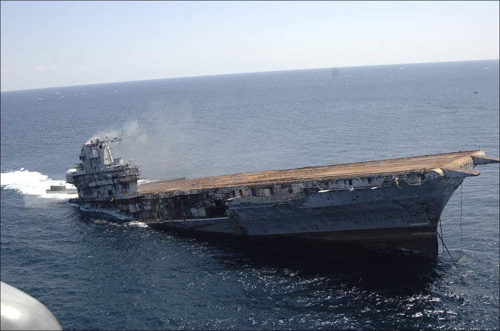 USS Oriskany listing to starboard with the stern beginning to sink