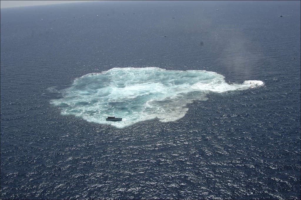 The surface after USS Oriskany sank, white foam on deep blue water