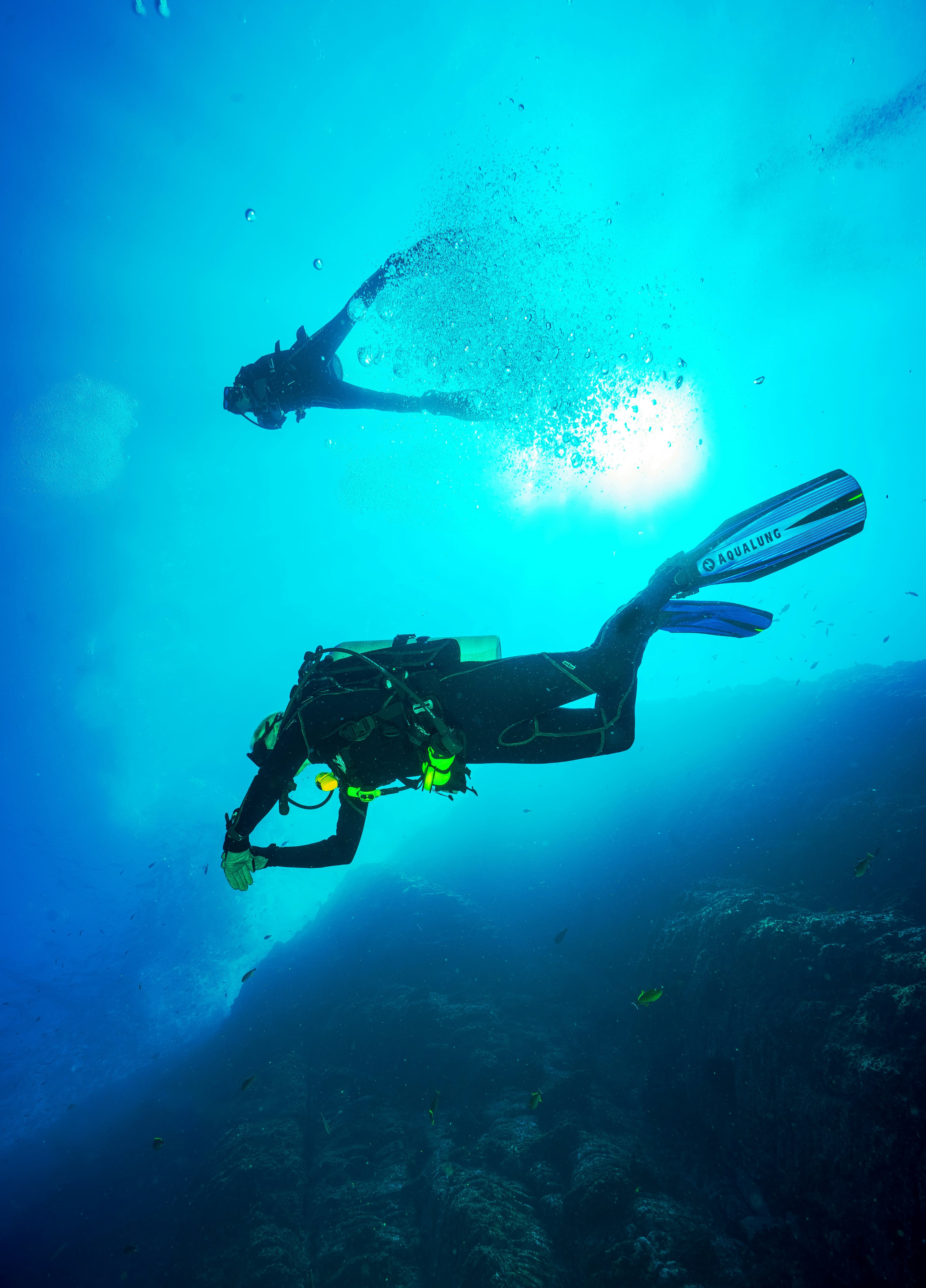 Buddy pair in clear water during a training dive